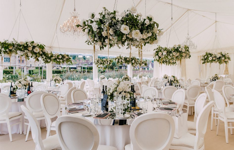 A wedding marquee with wedding flowers at Hever Castle